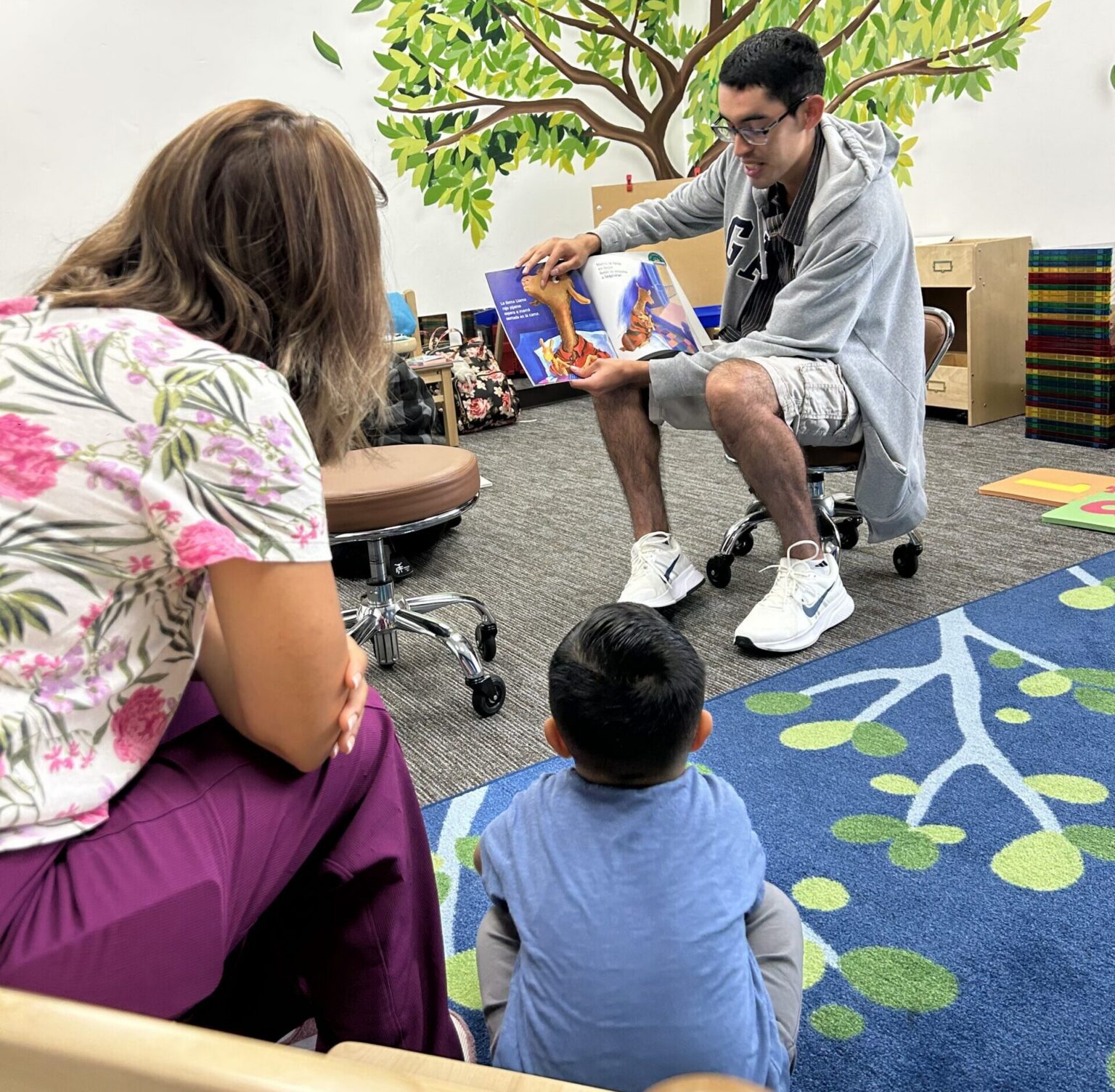 Reading Legacies Volunteer Reading at Family Story Hour